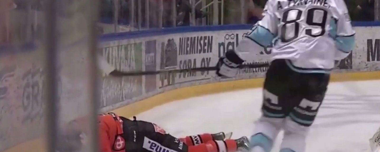 An absolutely bone crunching hit leaves one man out on the ice.