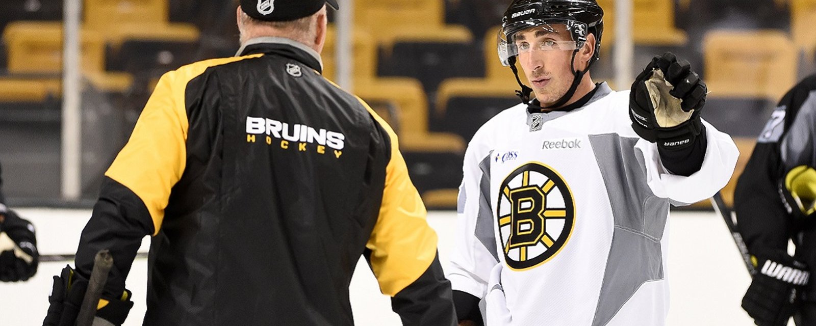 Cameras catch a hilarious moment between Brad Marchand and his coach.