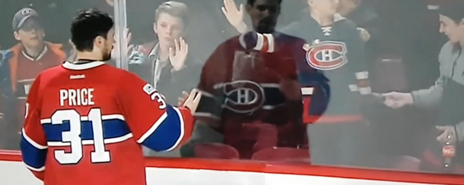 Carey Price gives young man a death stare after he steals puck from little girl.