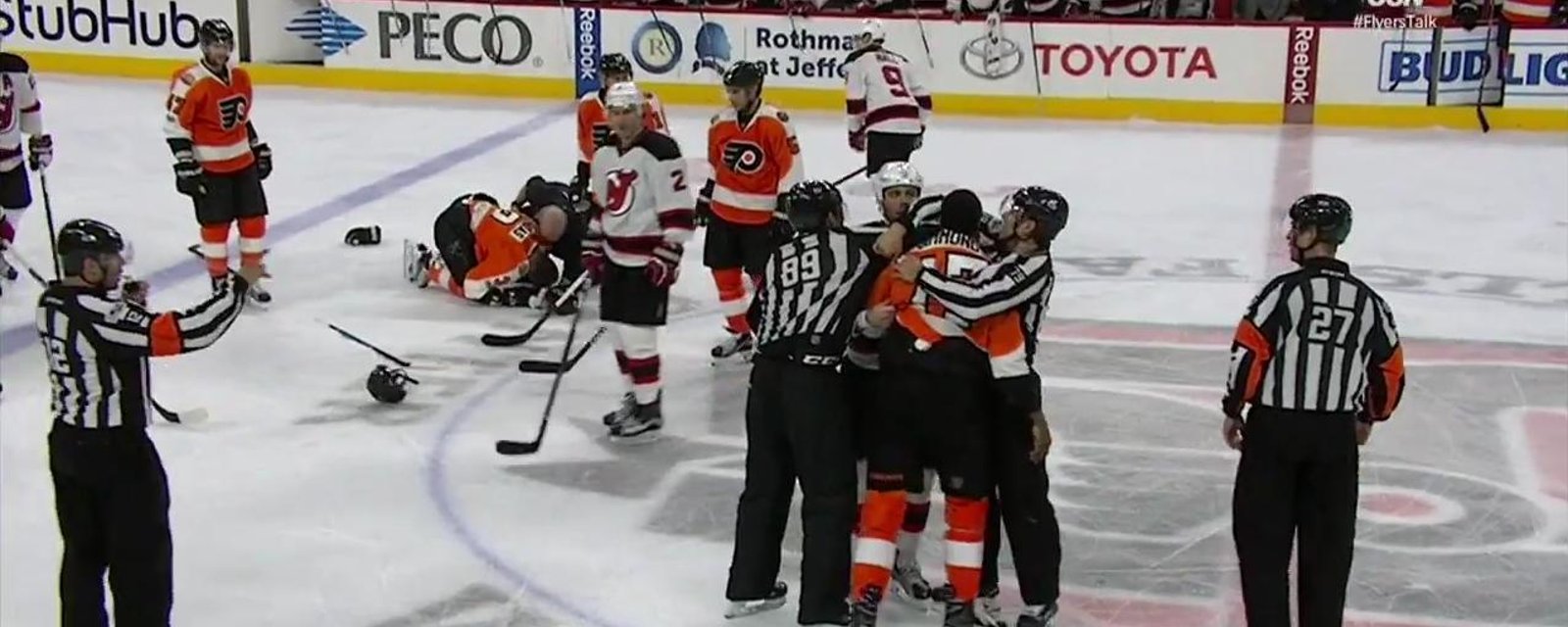 Flyers' defenseman out after questionable hit. 