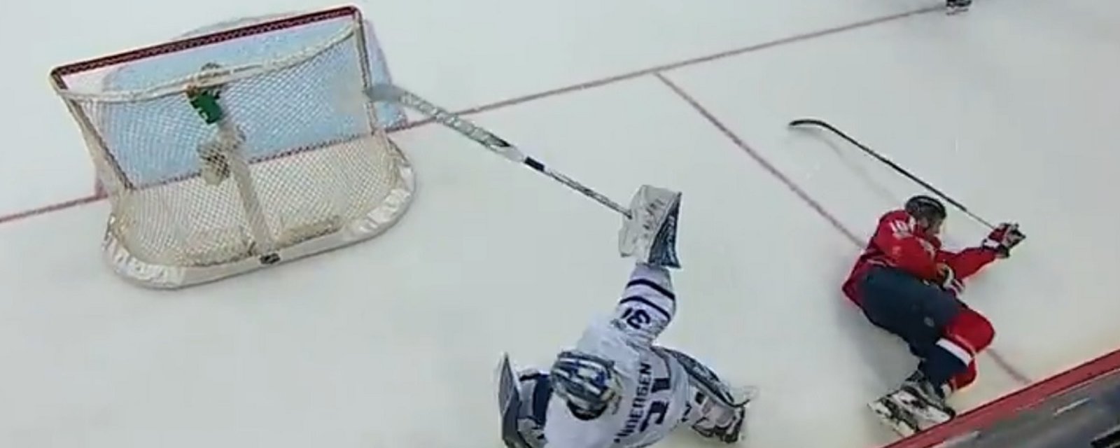 Leafs goalie Frederik Andersen delivers a big hit behind his net!
