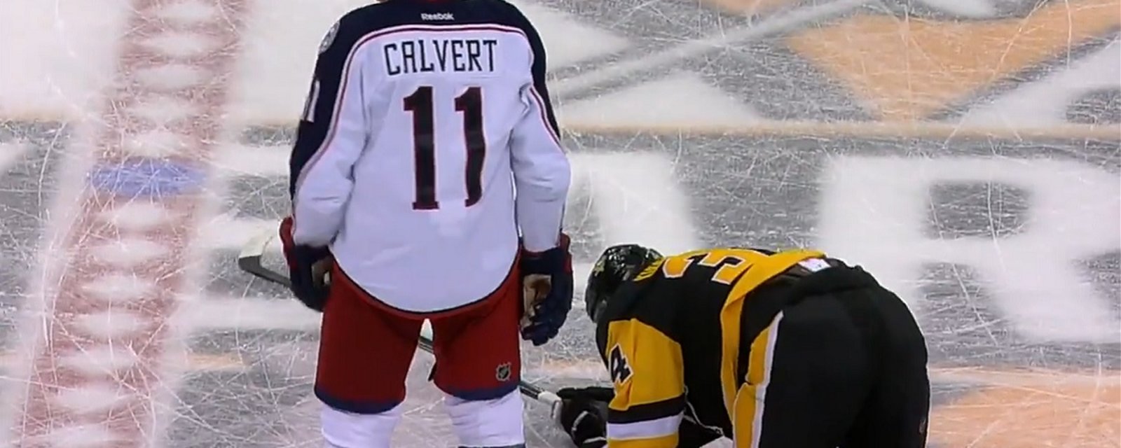Calvert literally breaks his stick over the back of his opponent!