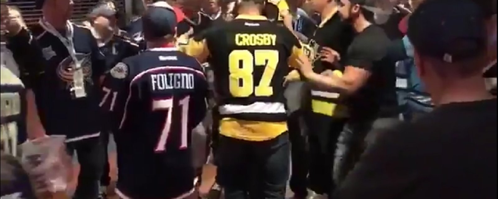 Crosby fan caught sucker punching another fan at the game.