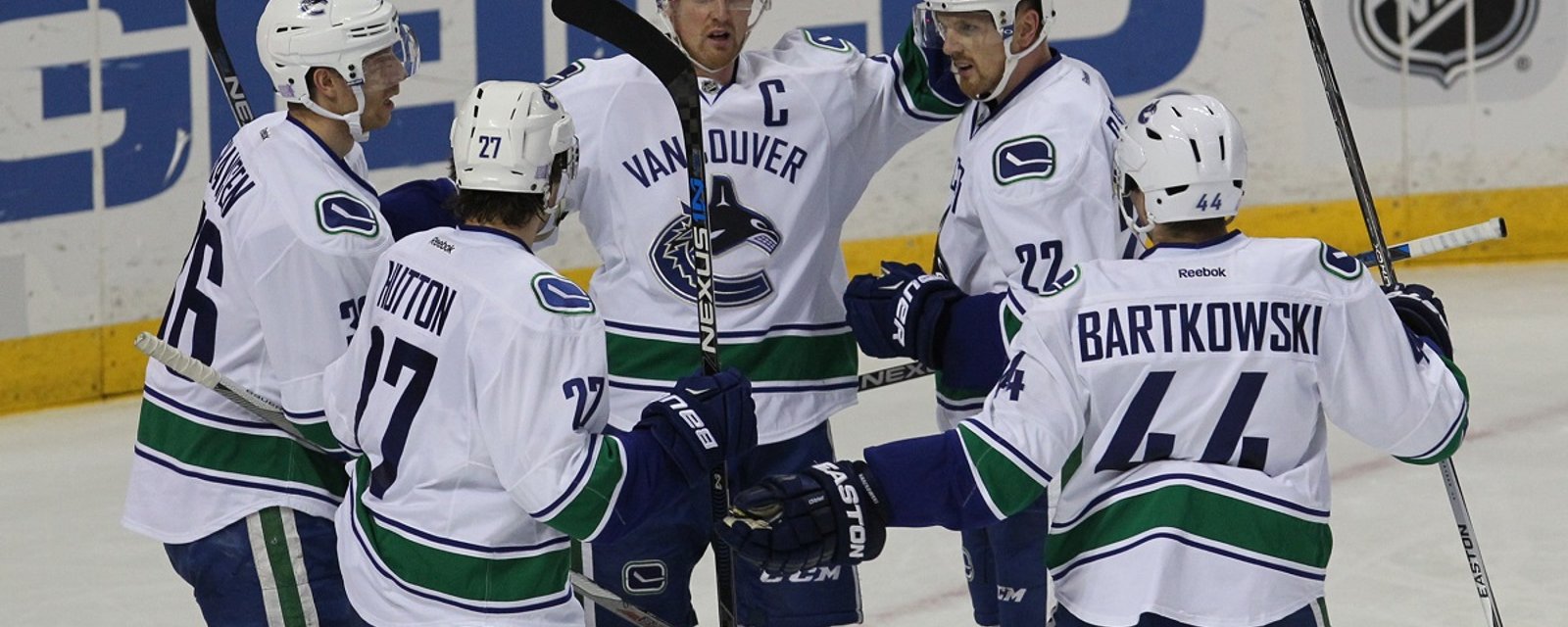 Canucks sing undrafted defenseman to two-year deal.