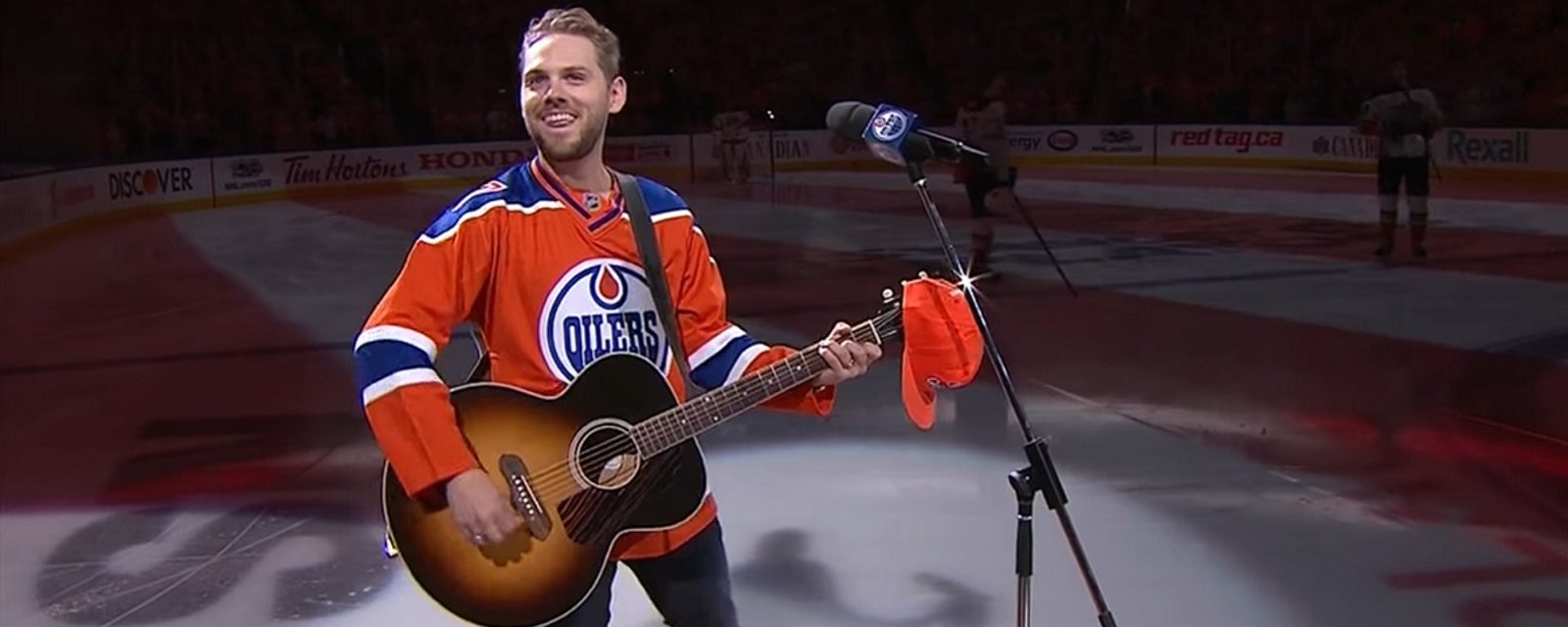 Microphone breaks during national anthem in Edmonton, and then magic happens.