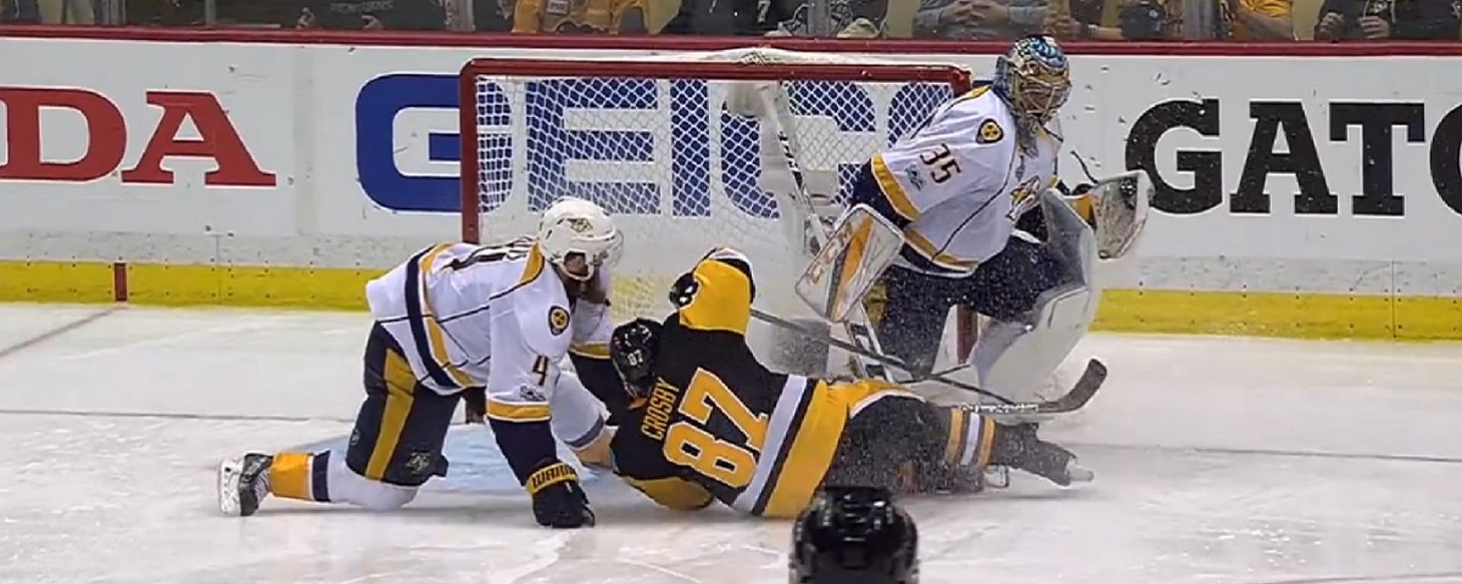 Crosby ends up in the back of the Predators net after minor contact from Ellis.