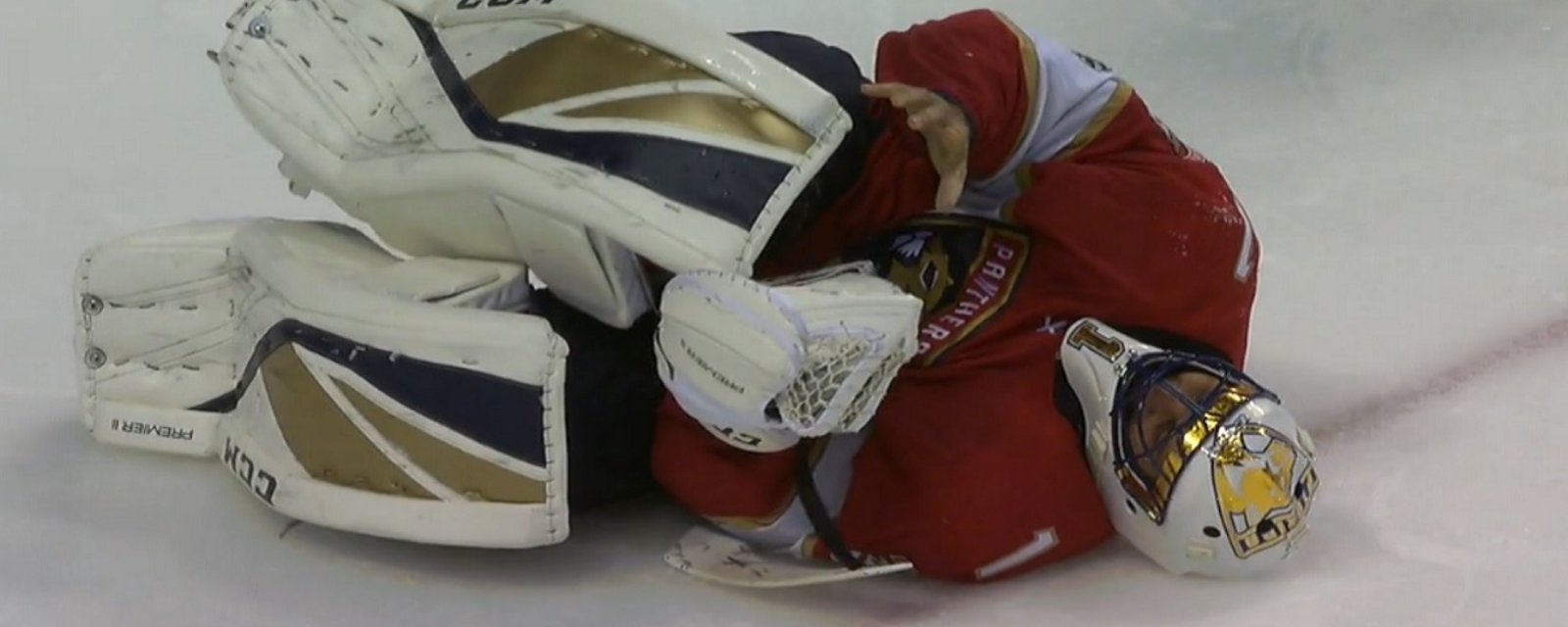 Breaking: Luongo goes down after getting hit in the crease.