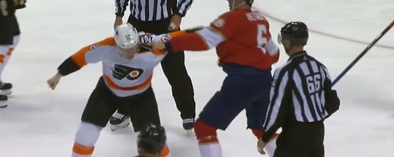 Petrovic keeps punching Raffl's head even when the refs try to stop him! 