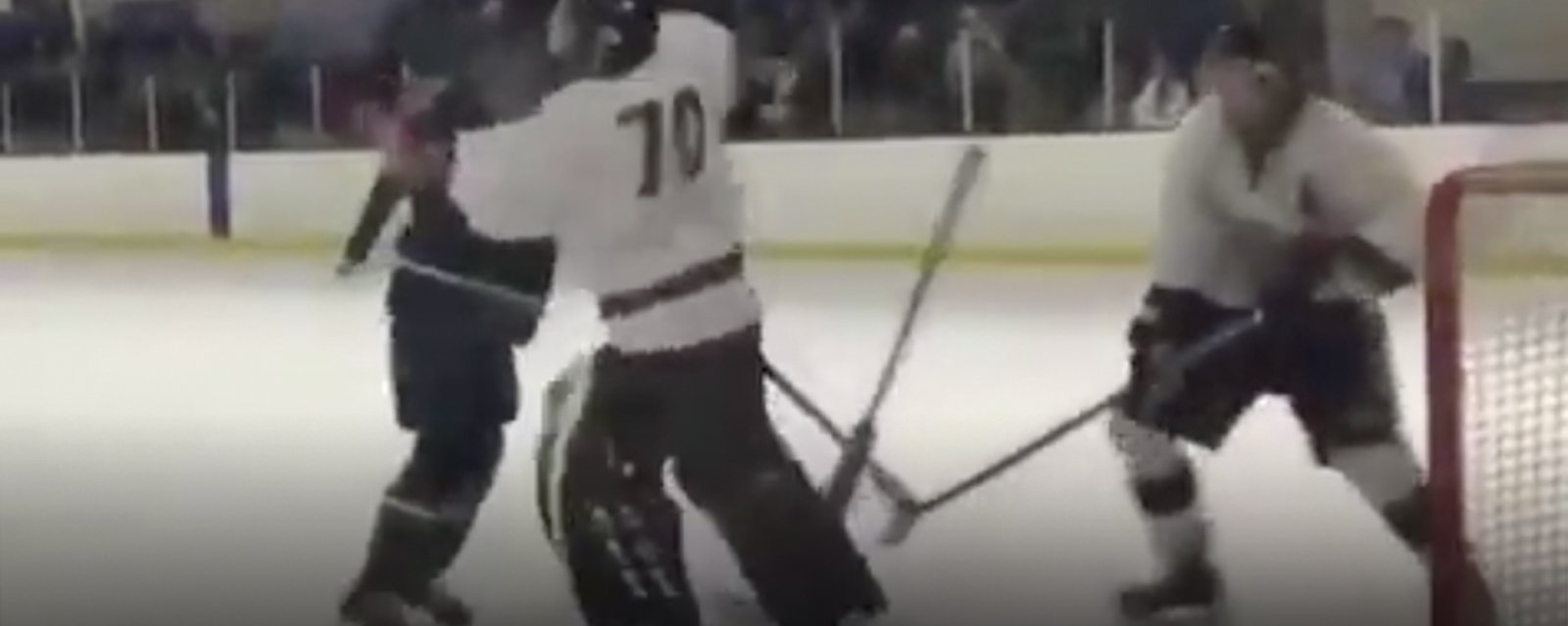 Goalie beats up player who crashed his crease, proceeds to get knocked out cold by charging opponent
