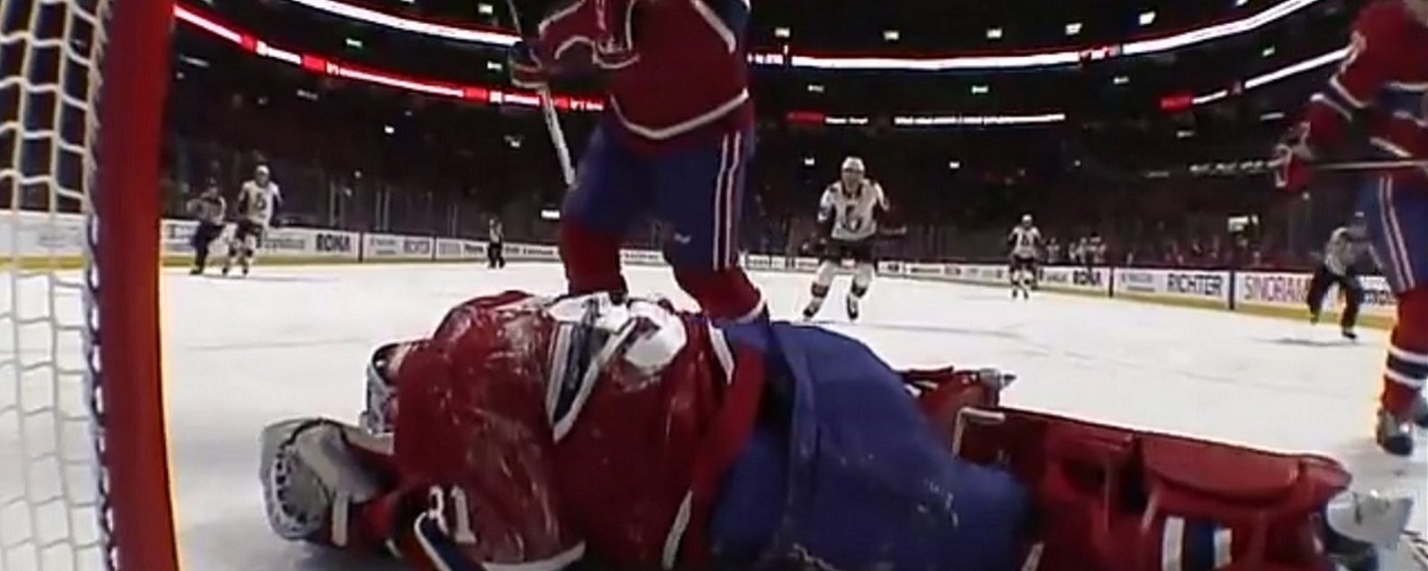 Breaking: Carey Price goes down after taking a cross-check to the head. 