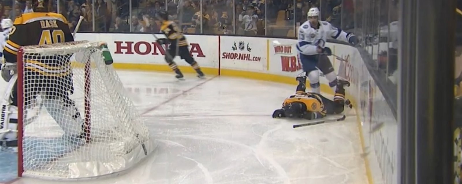Torey Krug gets drilled from behind, goes head first into the boards.