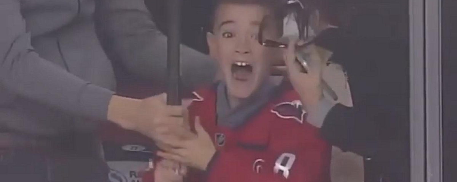 Ovechkin throws his stick over the glass and makes a young fan lose his mind.