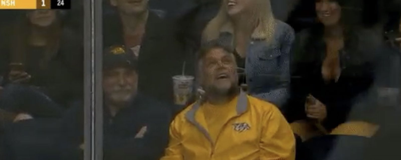 Preds fan saves sexy busty woman by blocking loose puck! 