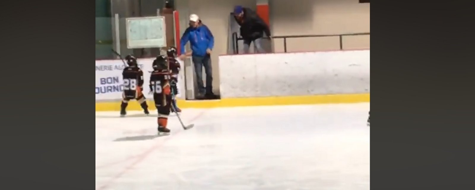 Awful video catches coach berating a young child during hockey game.