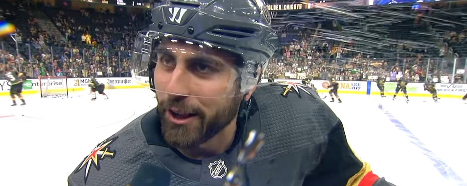 Alex Tuch gets soaked during pre game interview.