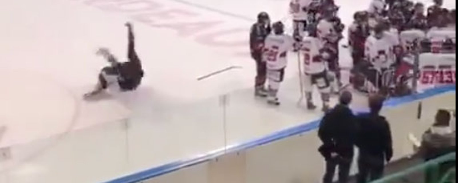 Player stretchered off the ice after brutal MMA style body slam!