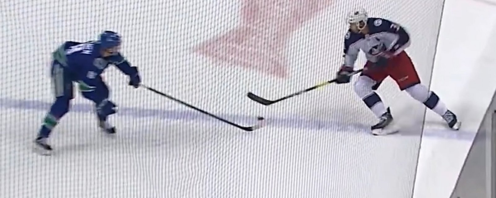 Jake Virtanen's hit misses Seth Jones and sends him face first into the boards.
