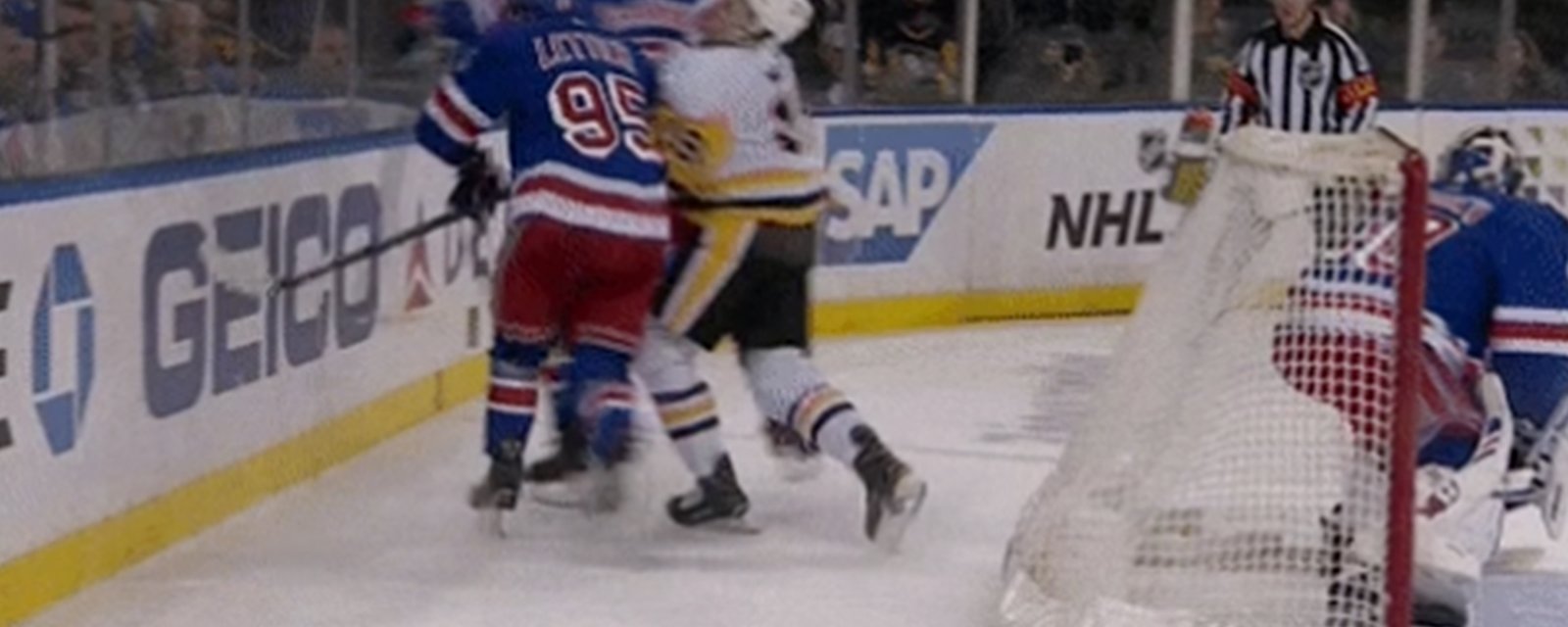 DeAngelo rocks McCann with headshot while the ref looks on