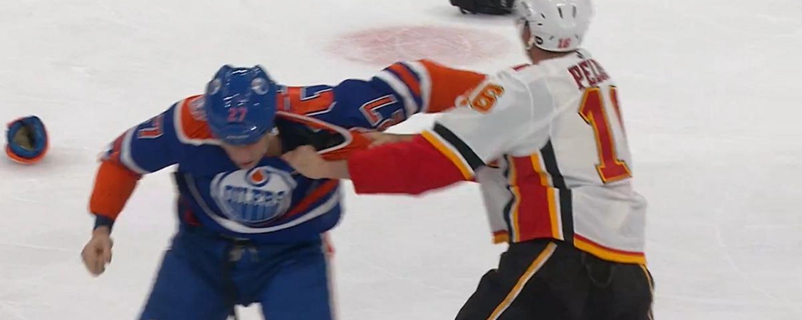 Anthony Peluso takes on Milan Lucic in the Battle of Alberta.