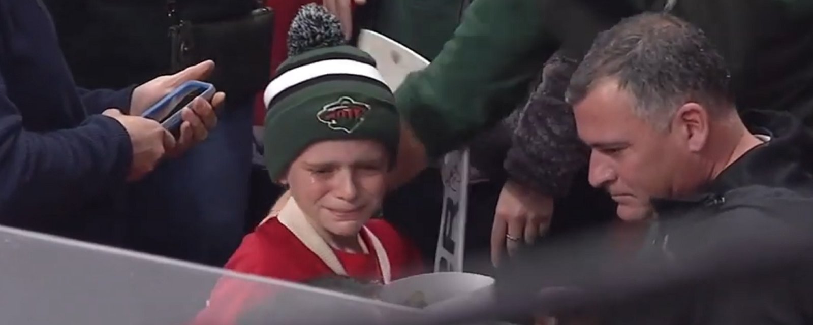 Devan Dubnyk brings a young fan and his father to tears.