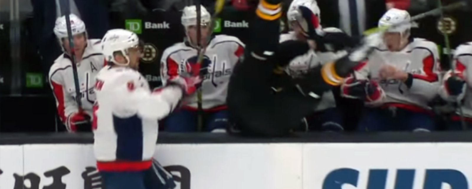 Ovechkin hits Chara into the Capitals bench!