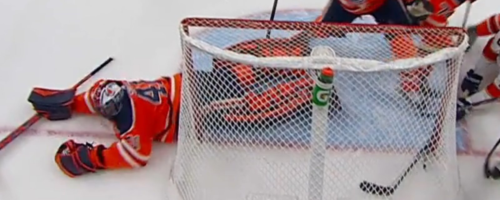 Oilers goalie Mike Smith goes down after a hard shot to his nether region.