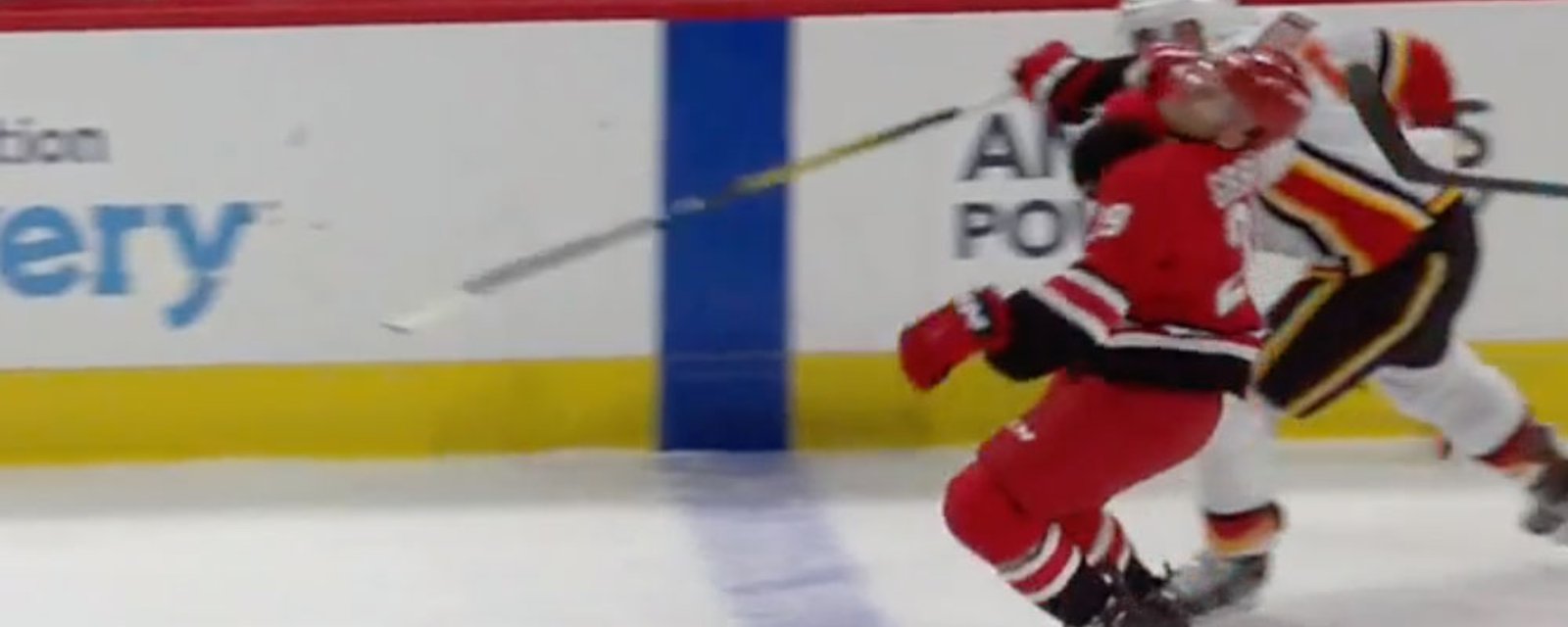 Flames’ Giordano wipes out Hurricanes’ Gibbons with clothesline!