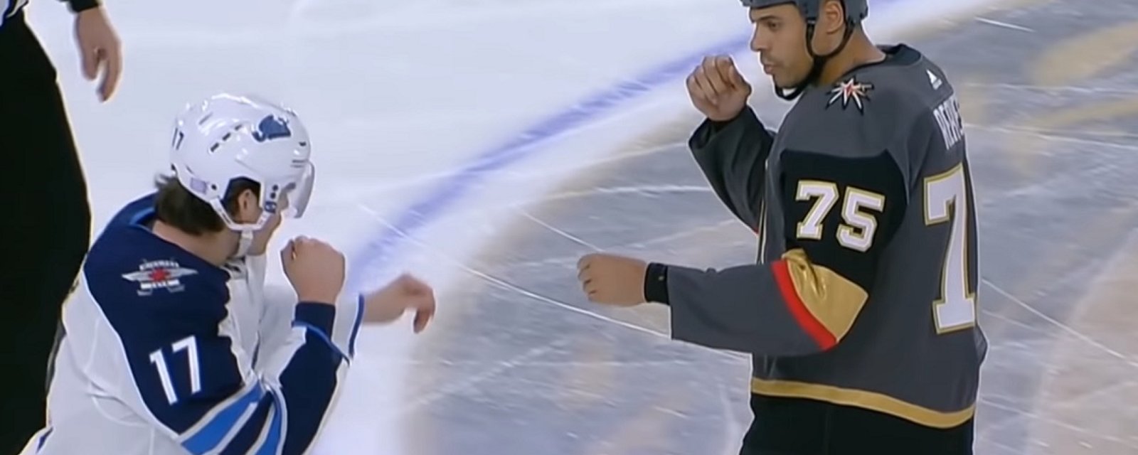 Ryan Reaves challenges Adam Lowry on the face off, but Lowry shows no fear.