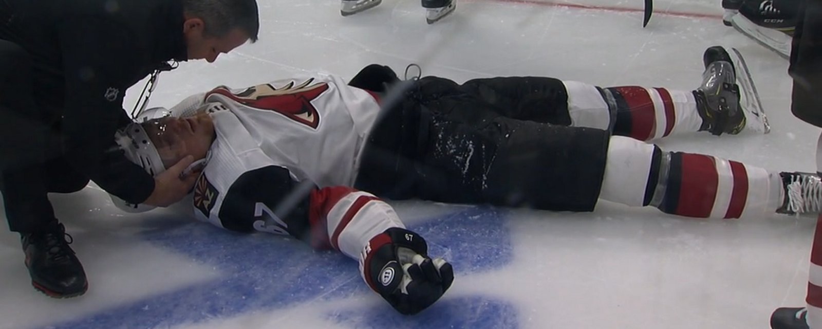 Lawson Crouse in bad shape after going head first into the boards.