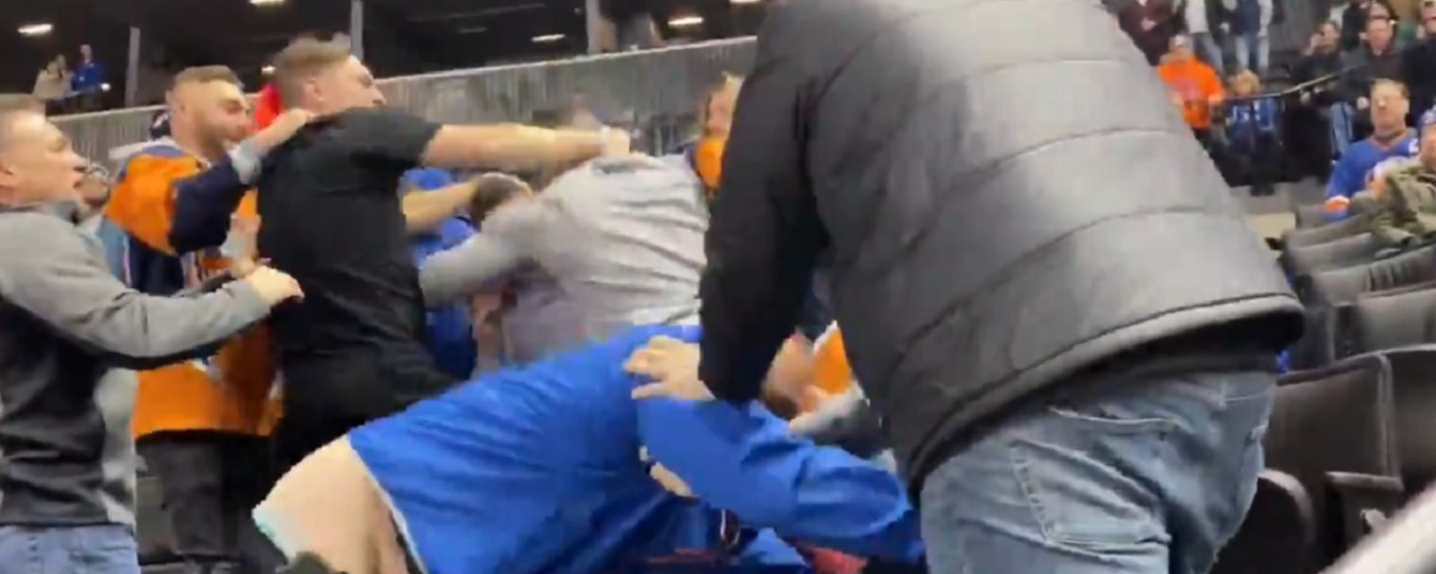 Brawl breaks out in the crowd at NHL game.