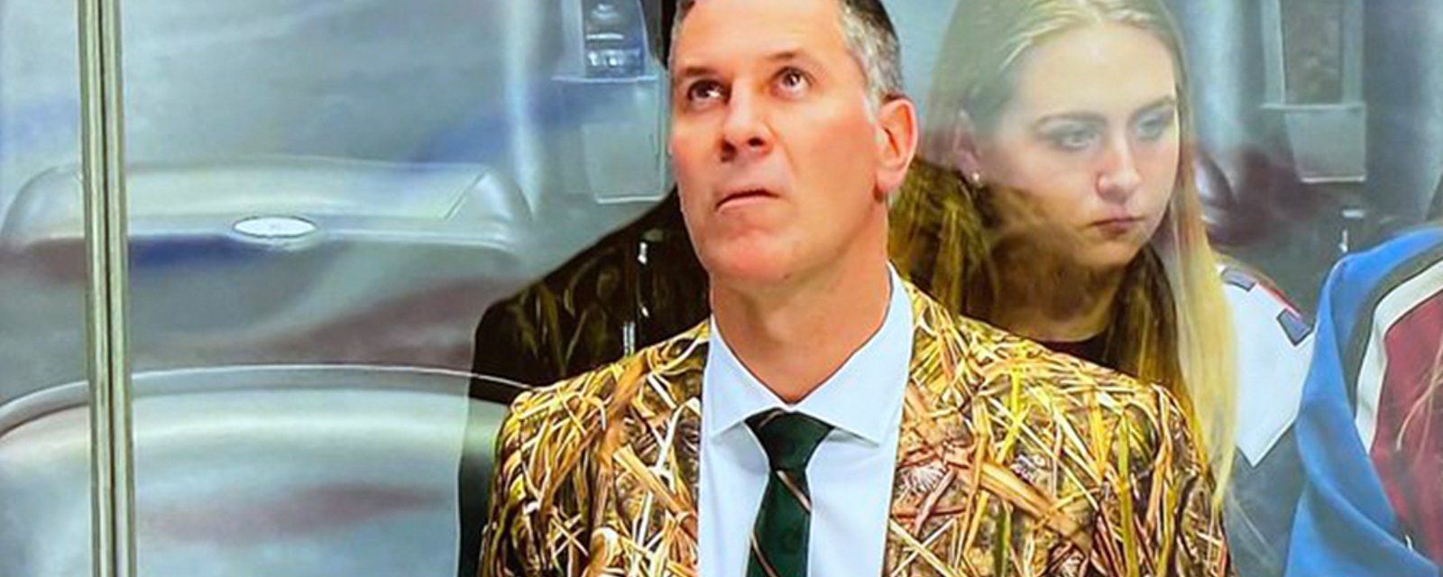 Jared Bednar rocks a camouflage suit behind the bench for Avs Military Appreciation Night