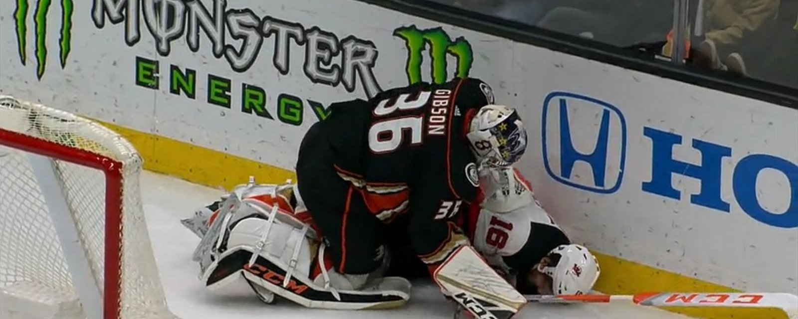 Ducks goalie John Gibson levels Kevin Rooney and then adds some trash talk for good measure.