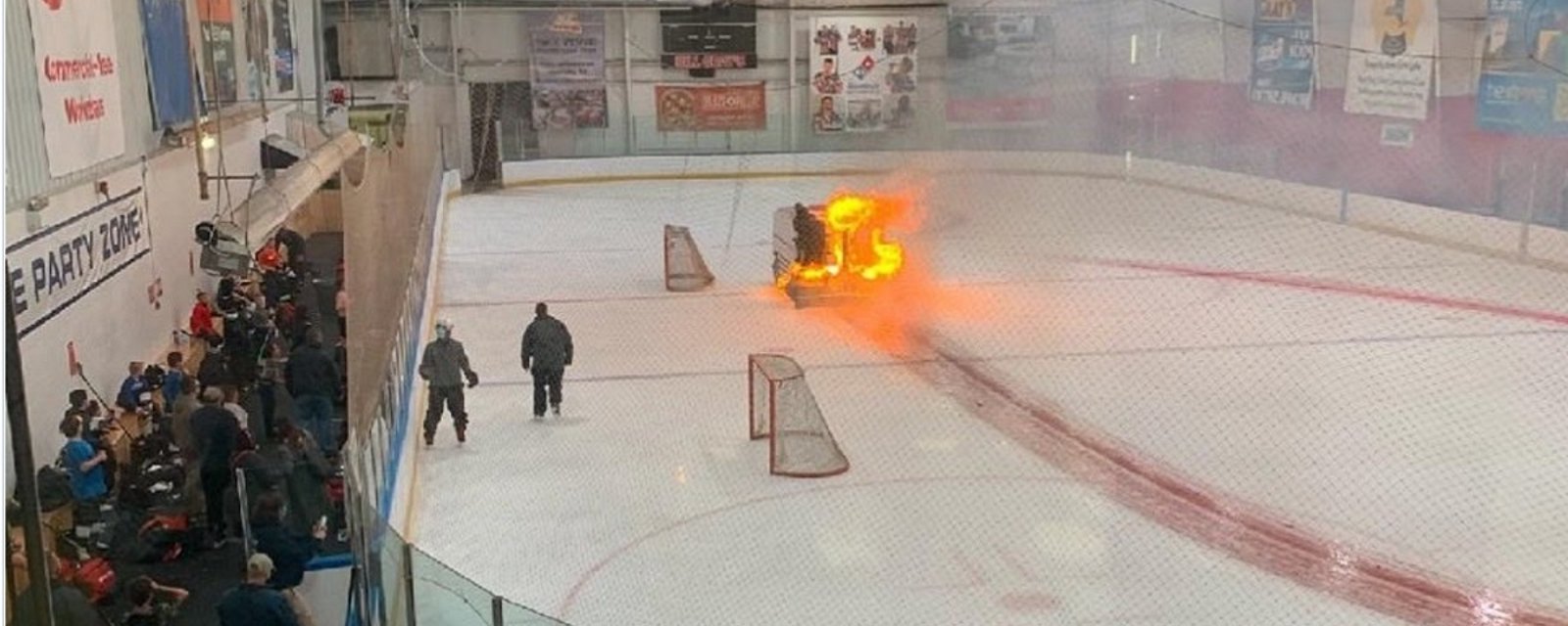 Flaming Zamboni steals the show at recent hockey event.