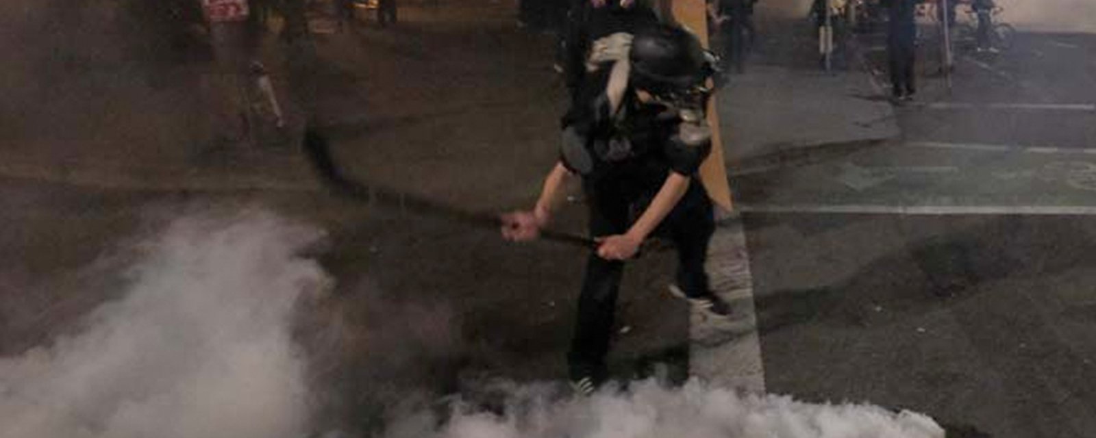 Protester uses hockey stick to slapshot tear gas canister at Portland police