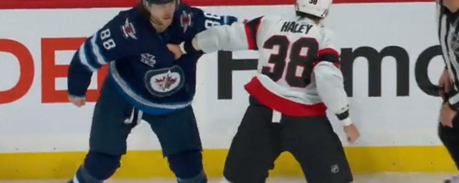 Beaulieu and Haley throwdown in front of the Jets bench.
