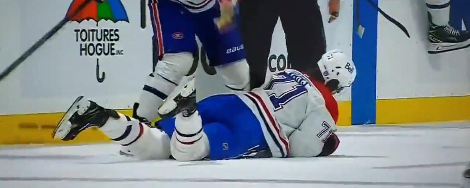 Jake Evans laid out after a high hit from Gudbranson.