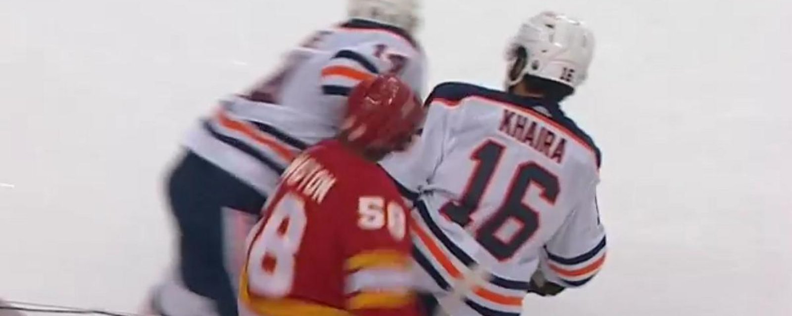 Jujhar Khaira takes out Oliver Kylington with a big hit to the head.