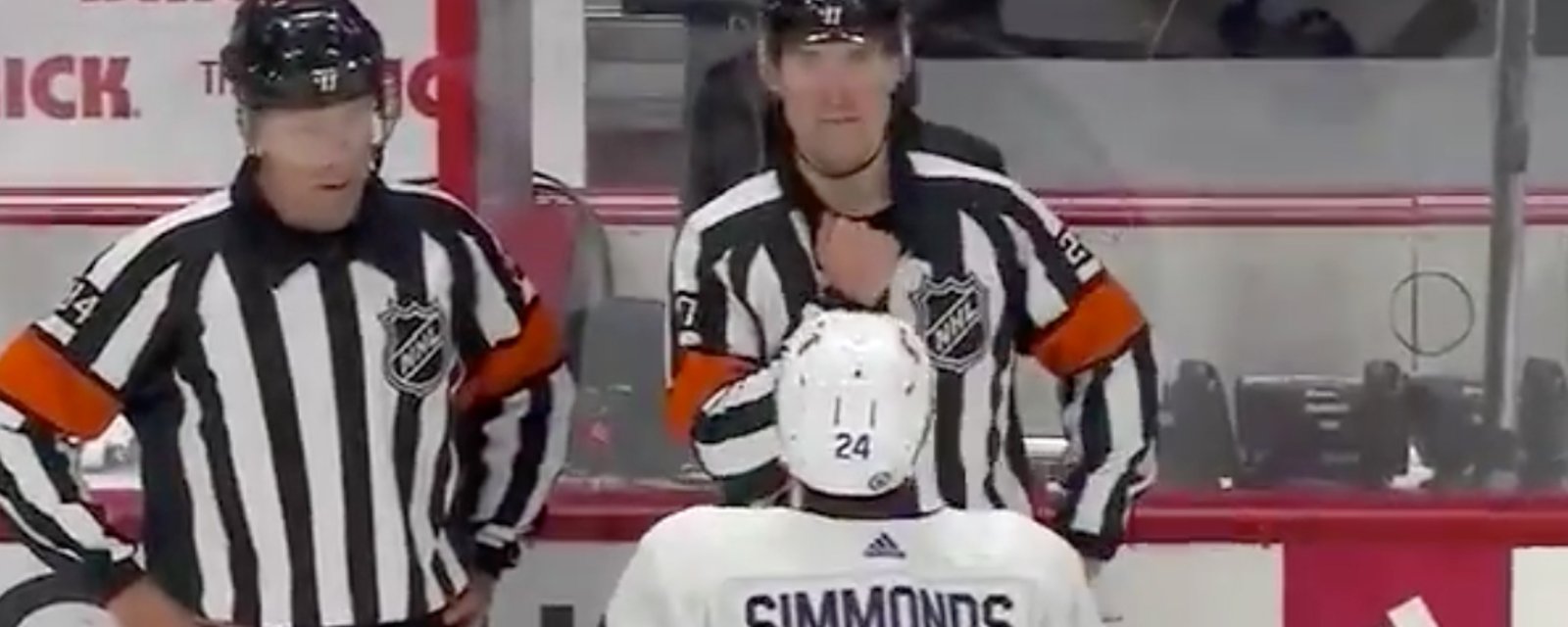 Camera catches referee Furlatt covering his mic after he missed a call 
