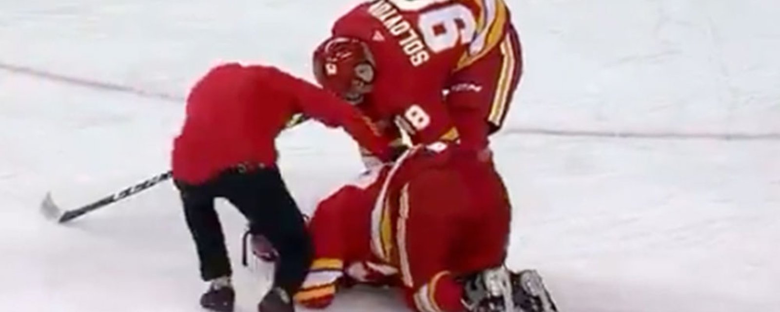 Flames top prospect Connor Zary collapses to the ice after taking slap shot directly to the ankle