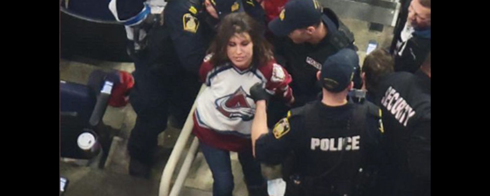 Female Avs fan knocks out Jets fan, leaves him bloodied and then cackles while being hauled off in cuffs