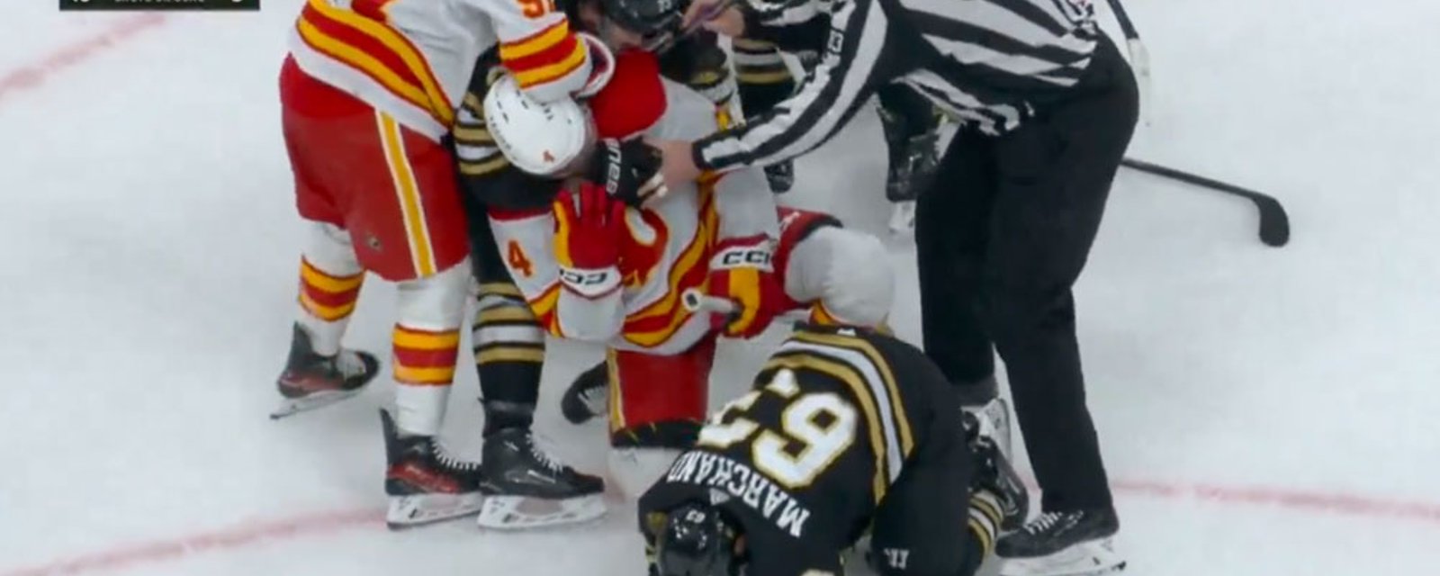 Brad Marchand gets destroyed by 4 Flames players
