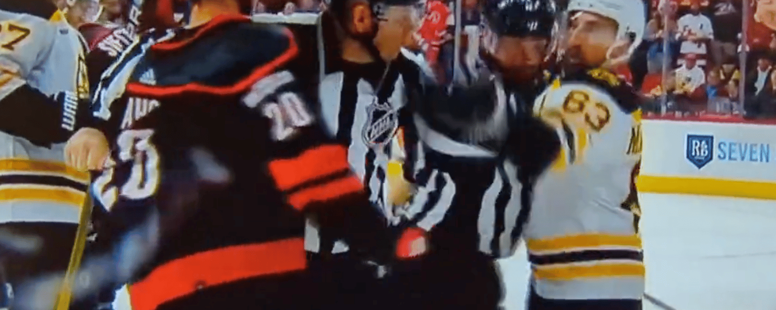 Brad Marchand accidentally slaps the linesman! 