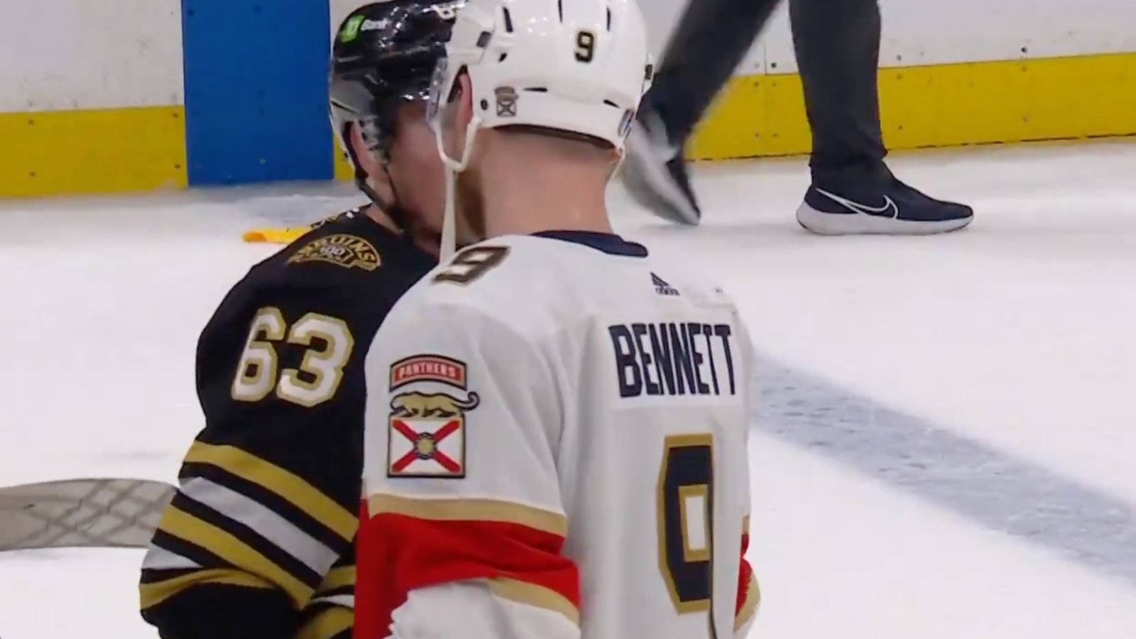 Brad Marchand has a word with Sam Bennett in handshake line