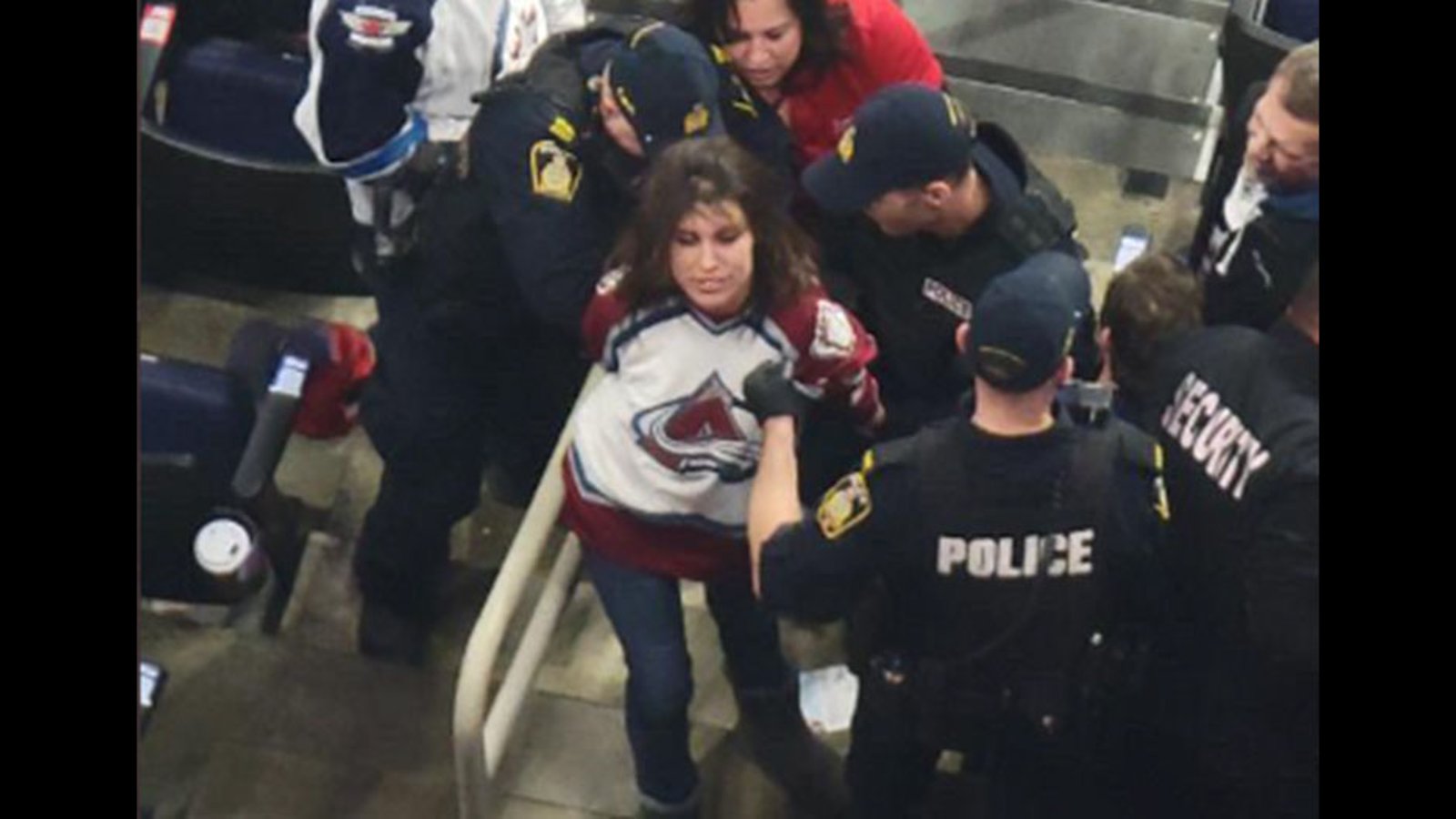 Female Avs fan knocks out Jets fan, leaves him bloodied and then cackles while being hauled off in cuffs
