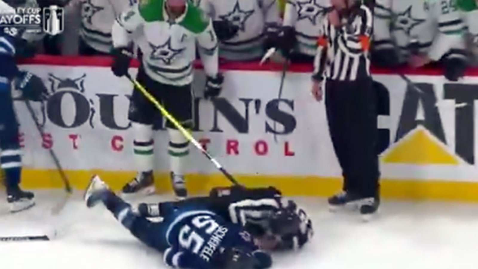 Jamie Benn clocks Mark Scheifele and the referee with a huge left