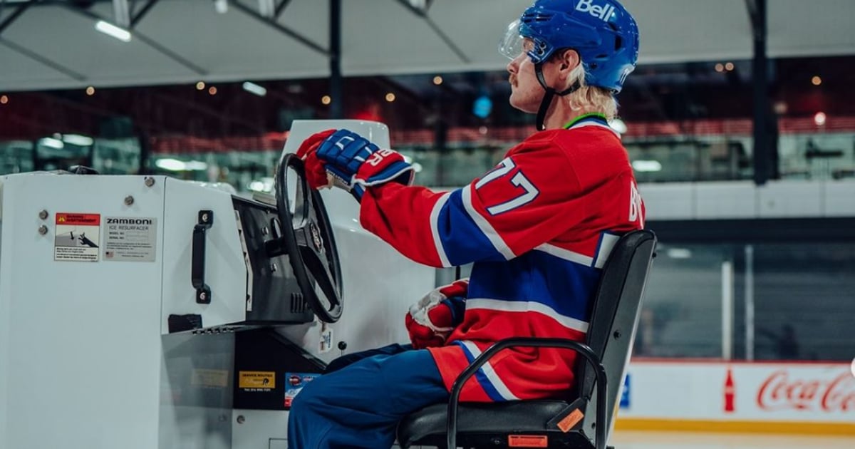 Valtteri Botas jumps onto the ice with Canadian players