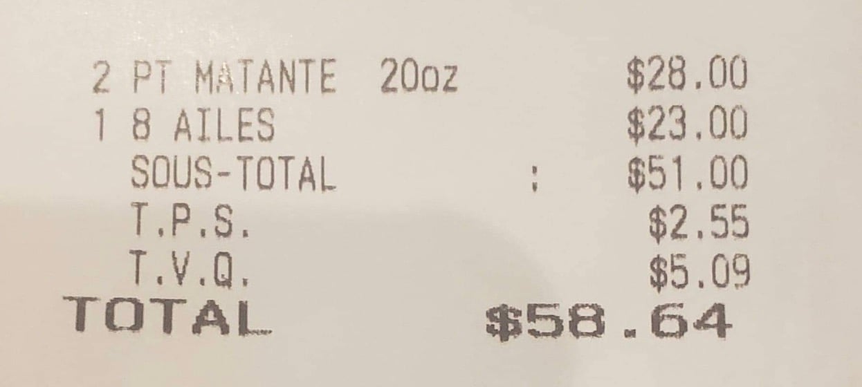 58,64$ pour 8 ailes de poulet et 2 bières.