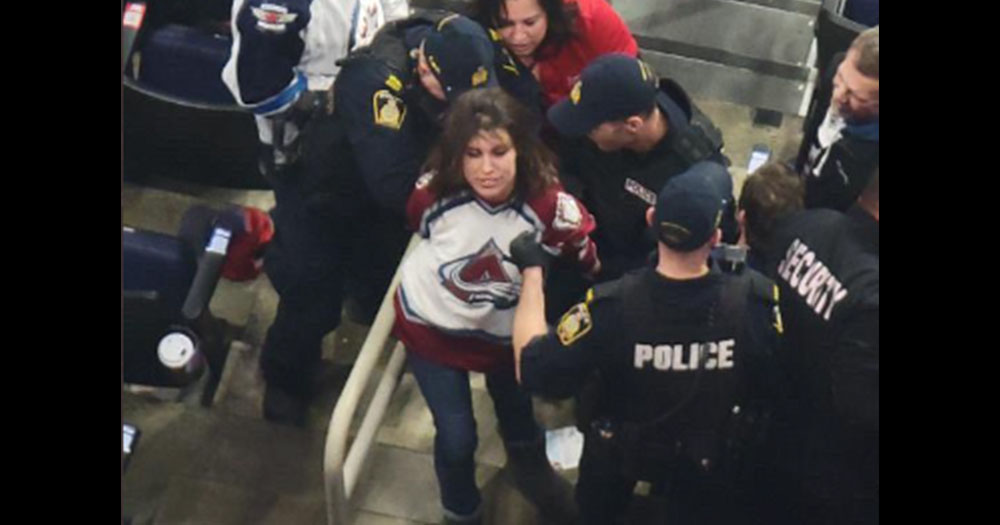 Female Avs fan knocks out Jets fan, leaves him bloodied and then cackles while being hauled off in cuffs