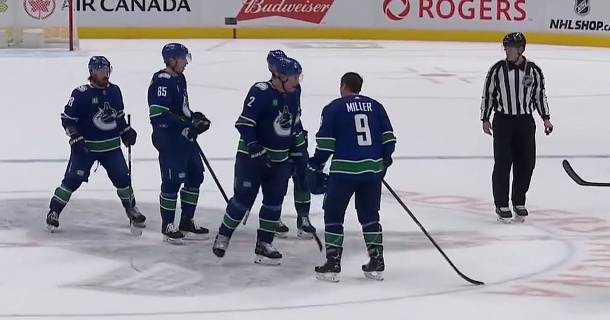 Teammates J.T. Miller and Luke Schenn get heated on the ice.