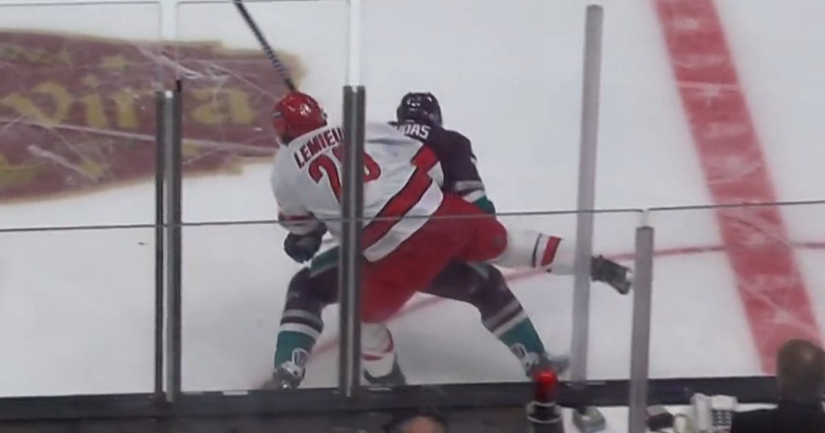 Radko Gudas levels Brendan Lemieux with a hip check.